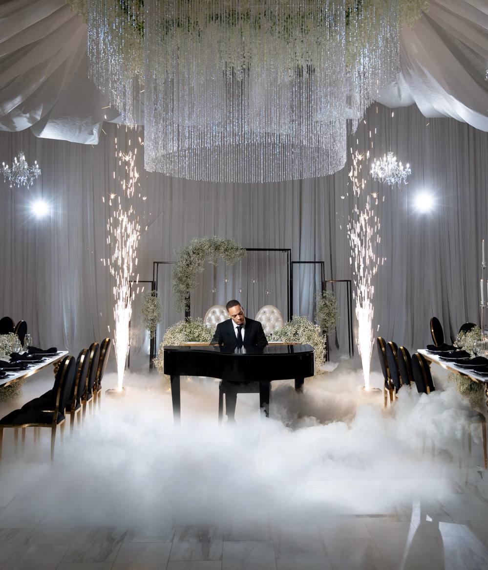 Jerel Crockett performing at a wedding with grand piano